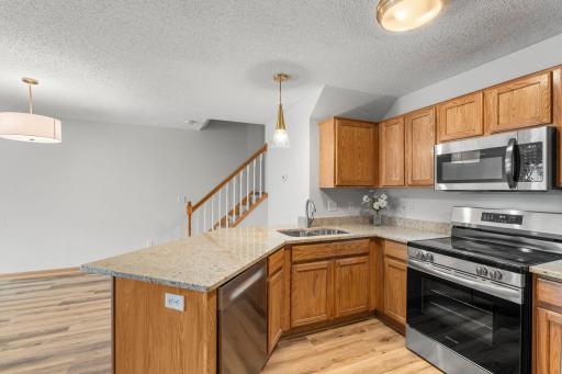 Entertain in Style with the Open Design! Snack Bar Space for 3 plus Dining Area easily seats 6 and can expand to Living Room.
