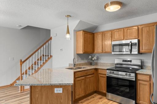 New LVP Flooring in the Kitchen, matches the entire Main Level