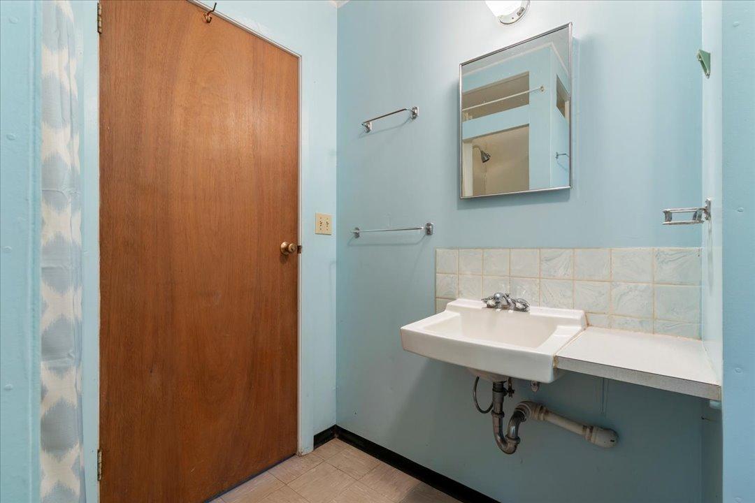 3/4 bathroom in the main cabin also houses the hot water heater.