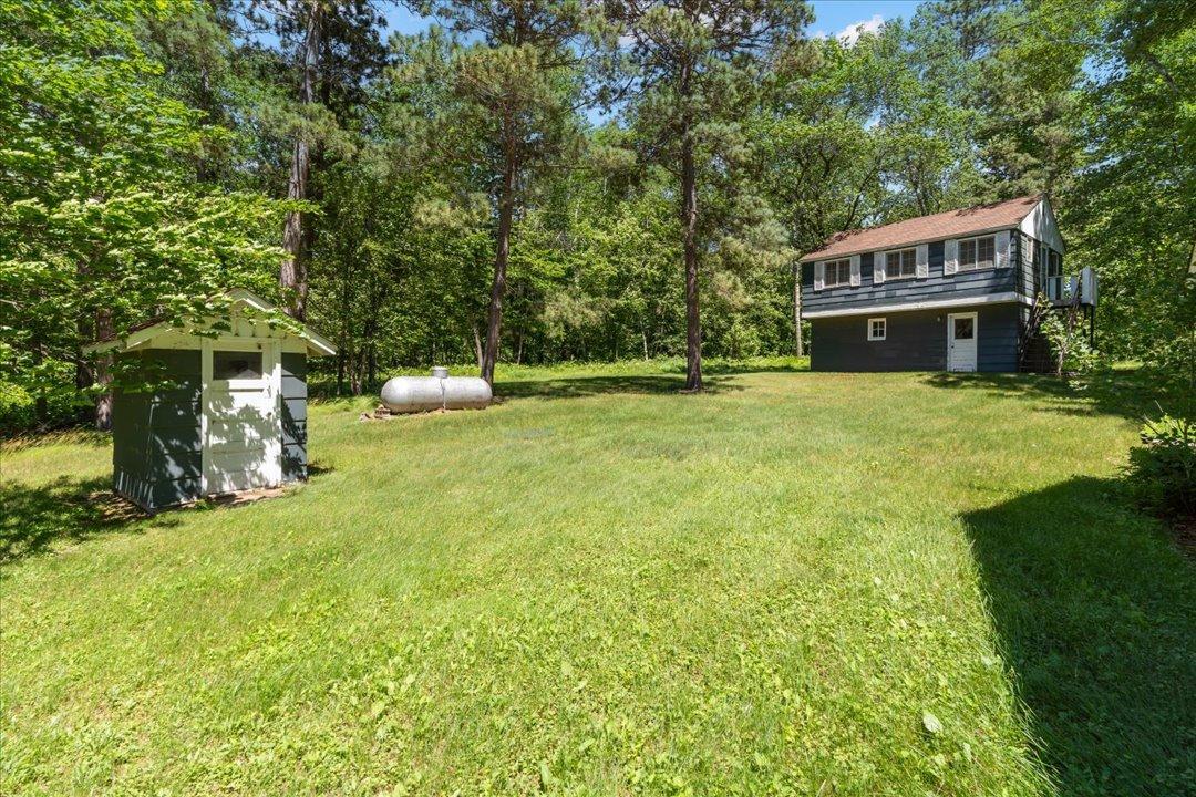 View of the property from the Lake. The small shed on the left houses the well that serves the property.