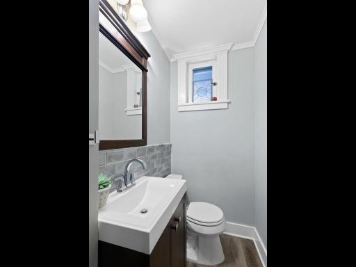Tastefully updated powder room on the first level with contemporary fixtures and neutral tones.