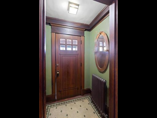 Historic vestibule entry showcasing beautifully preserved mosaic tile.