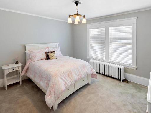 Beautifully updated bedroom that honors the homeâs historic craftsmanship.