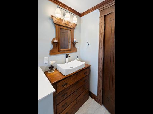 Updated full bath on the upper-level blending contemporary fixtures with timeless historic detail.