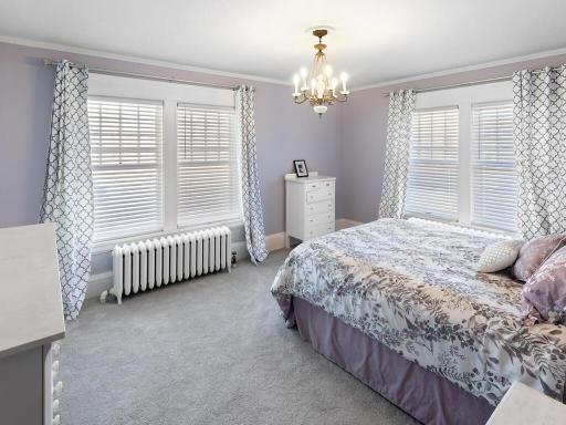A generously sized bedroom filled with natural light, complete with a large closet and inviting layout.