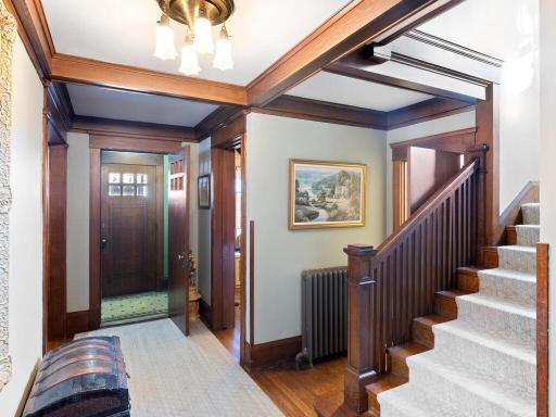 Welcome in to this beautiful historic home with stunning wood details, timeless staircase design, and preserved architectural character.