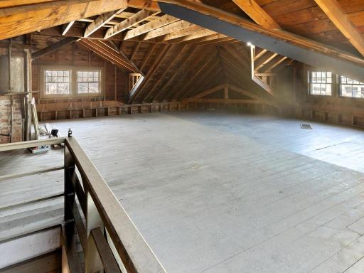 A remarkable unfinished attic with soaring rooflines and ample square footage, offering endless possibilities.