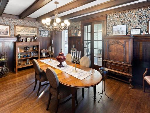 Formal dining room with preserved architectural detail, connecting to the sunroom and a butlerâs pantry.