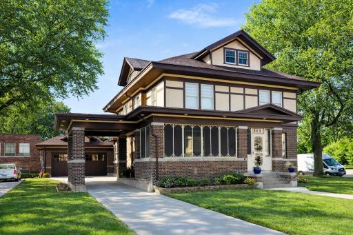 Beautifully preserved 1913 Craftsman style historic home located at 915 Fountain Street, showcasing timeless craftsmanship, classic brick and stucco exterior, and an inviting screened front porch.