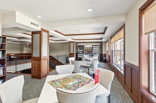 Enjoy a puzzle or read a book in the upper level community area.