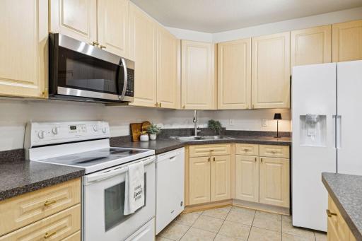 A nicely sized kitchen with plenty of cabinetry and counter space.