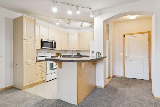A spacious kitchen. Coat closet is located to the right.