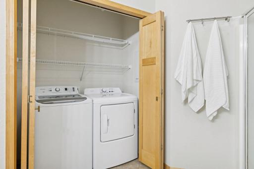 In unit laundry. Maple closet doors and trim.
