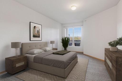 New carpet in bedrooms. The primary bedroom gets great natural light. (digitally staged)