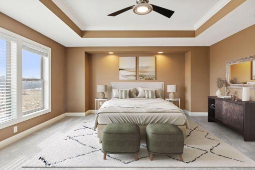 The owner’s suite feels like a retreat, complete with a tray ceiling, large picture window overlooking the preserve. (digitally staged)