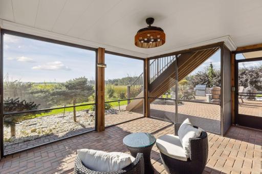 This screened-in portion of the patio is perfect to staying out of the elements and bugs. It has a finished ceiling and electrical.