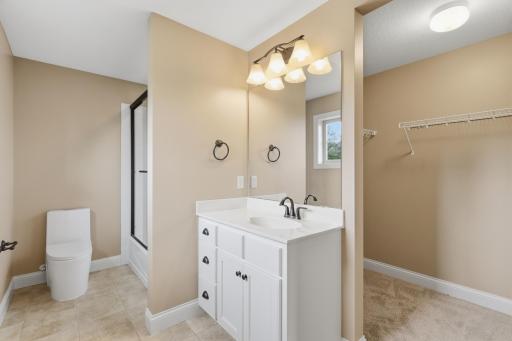 On-suite bath and closet for upper level bedroom.