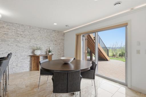Sliding patio doors provide direct access to the backyard entertaining area, making indoor-outdoor living seamless.