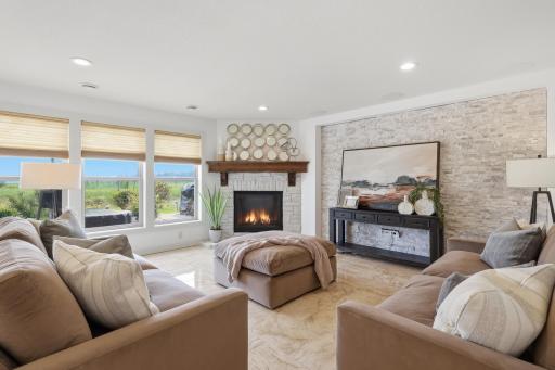 The LL family room includes a gas fireplace, huge TV space, ceiling speakers and plenty of space for gathering