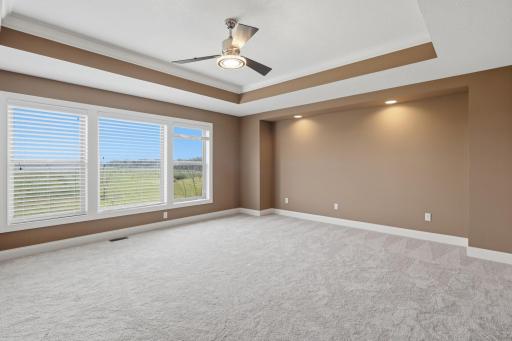 Owner's bedroom overlooks the backyard and open landscape.
