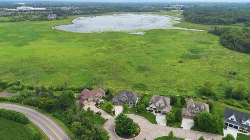 22 Leaf Wing Drive sits in front of an absolutely gorgeous background in Rapp Farm.
