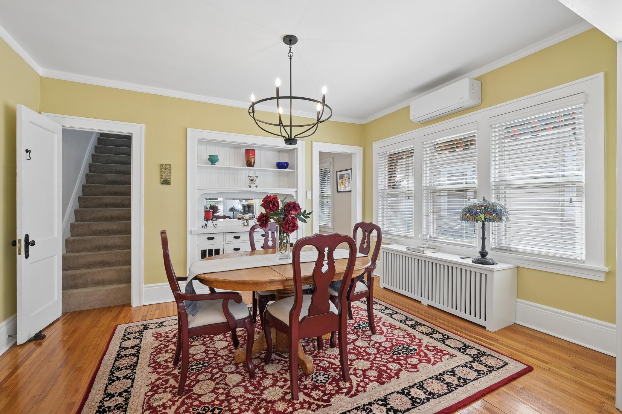 Spacious and sunny dining room with built-in buffet.