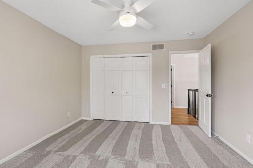 Third bedroom with brand new carpet and large closet.