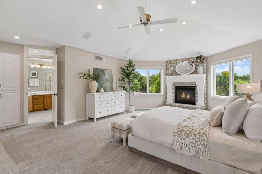 Vaulted primary suite with gas fireplace, all recently painted with brand new carpet.