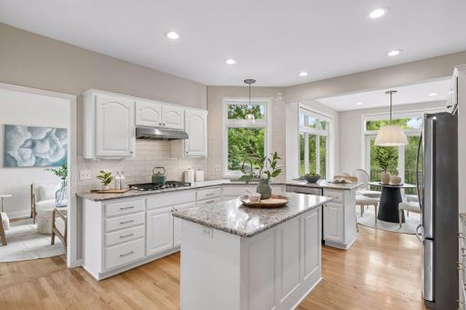 Granite countertops and a large kitchen island.