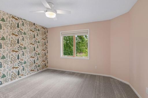 Second bedroom of four upstairs, with brand new carpet.
