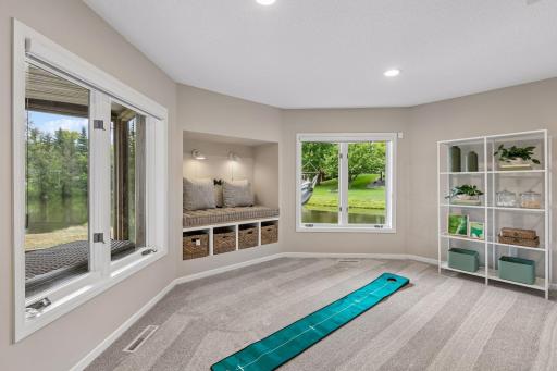 Custom alcove bench with sconces, custom cushion, and baskets for storage