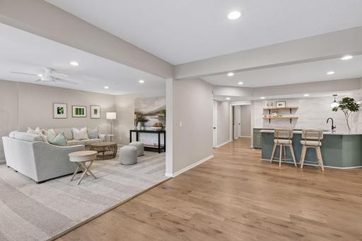 Fully finished walkout lower level includes a large rec room, wet bar with Bosch dishwasher, fifth bedroom, wine cellar, and multiple storage rooms.