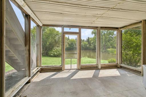 Convenient screened porch leading to the backyard.