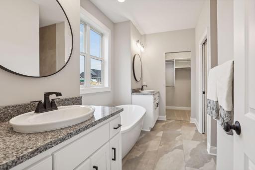 Owners Bath with Tile Floors & Granite Top Vanities.