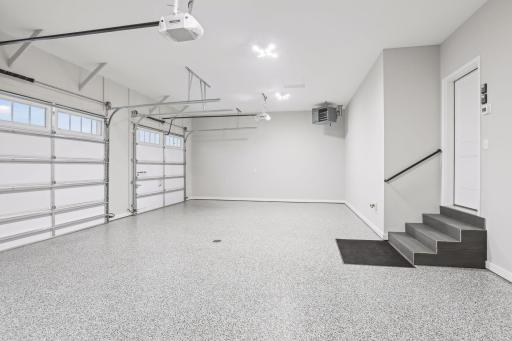 Finished Garage - Heater, Fully Insulated, Poly Floors, Drain, 2 GDO.
