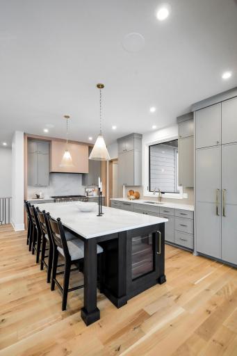 Kitchen island with beverage refrigerator