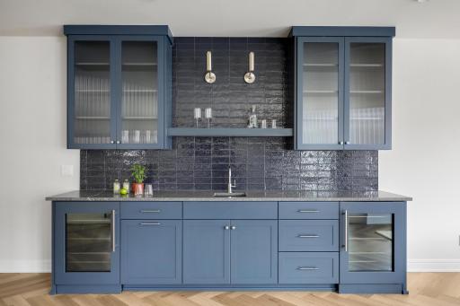 Lower level wet bar with double beverage refrigerators