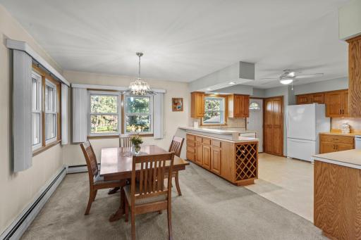 Sunlit dining area that opens to the kitchen for easy daily living and entertaining.