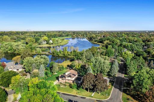 The backyard features serene views of Rogers Lake