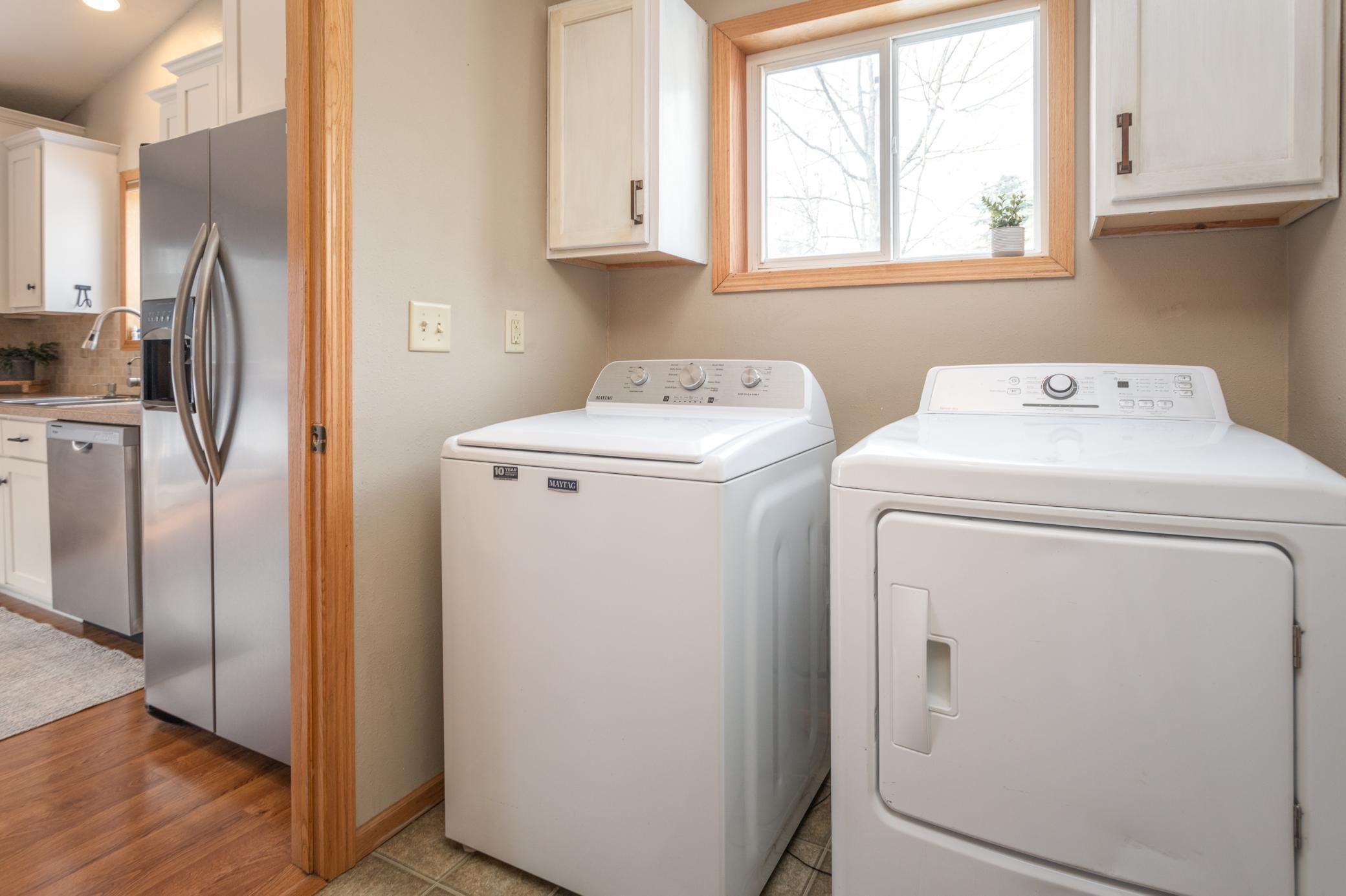 Main floor laundry that heads into the garage and right off the kitchen