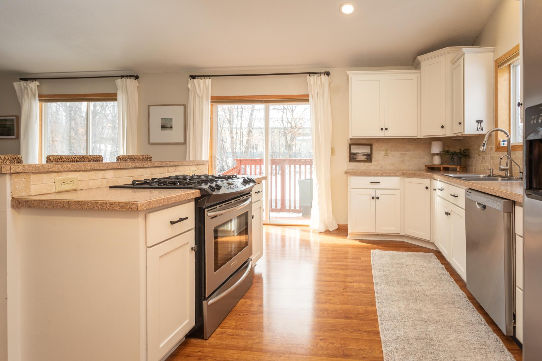 Perfect location of deck for grilling or to go to the backyard