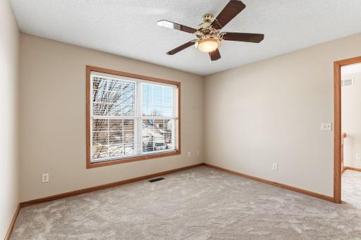 Third upper level bedroom with walk-in closet
