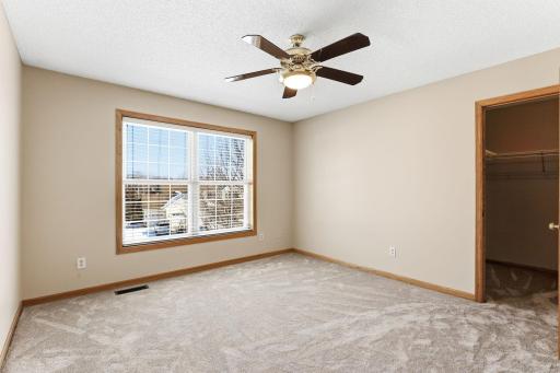 Fourth upper level bedroom with walk-in closet
