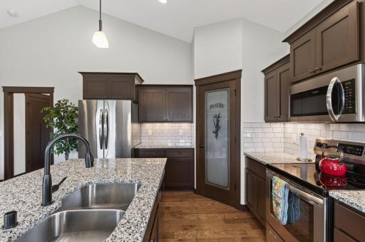 Another angle of the kitchen, walk-in corner pantry