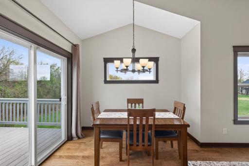 Dining area has a patio door that opens to the deck