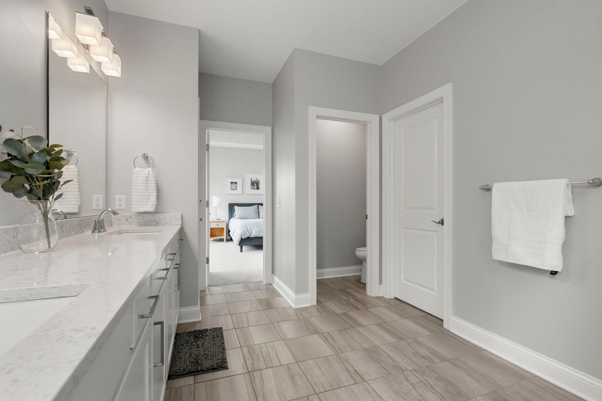 And the coveted private water closet space, too! The door to the right of is the large walk in closet.