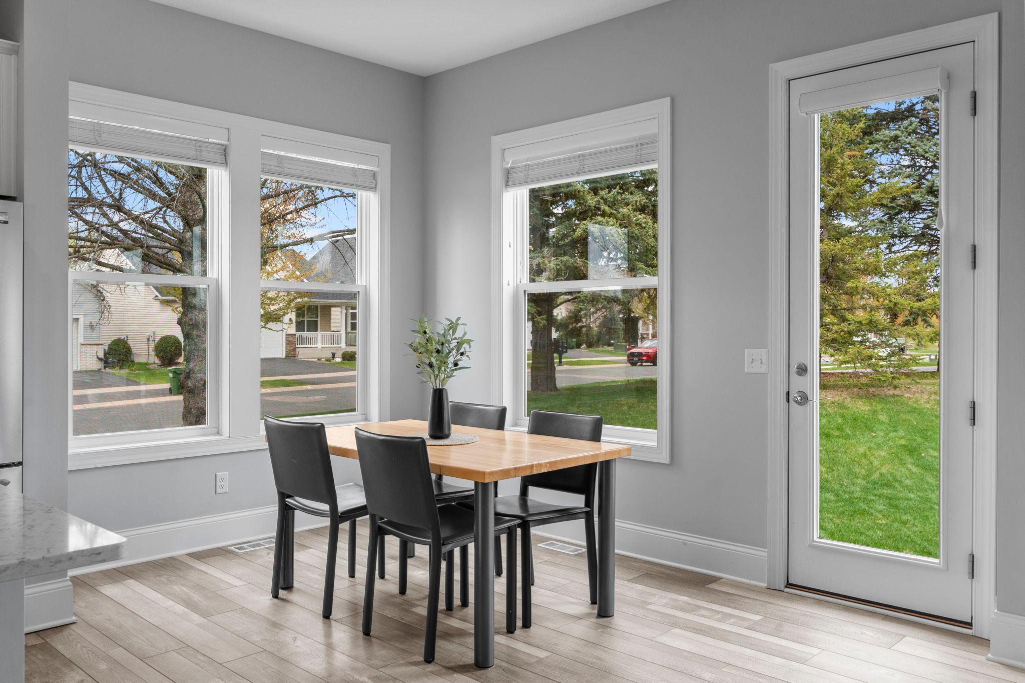 Informal dining space with an atrium door to the back yard.