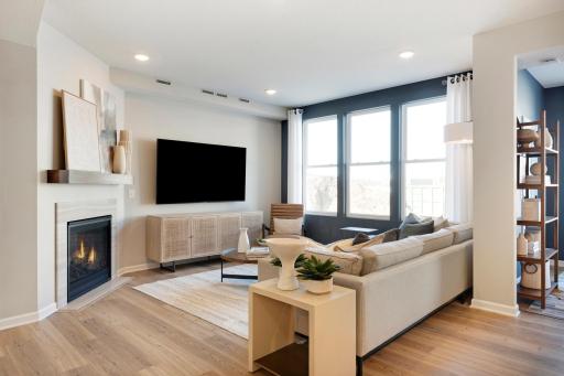 The Ashton living room has more than enough leg room for any furniture configuration you may want! Photo of model home.