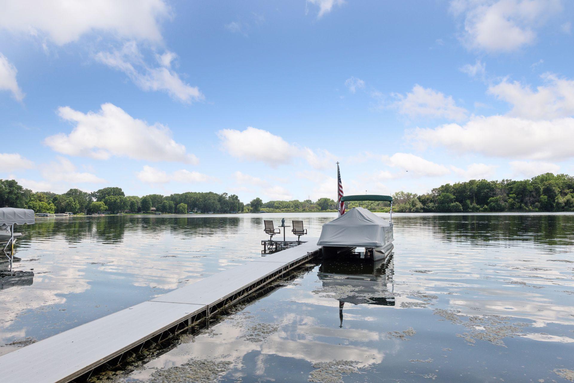 Near and acre plus 100 feet of Medicine Lake shoreline!