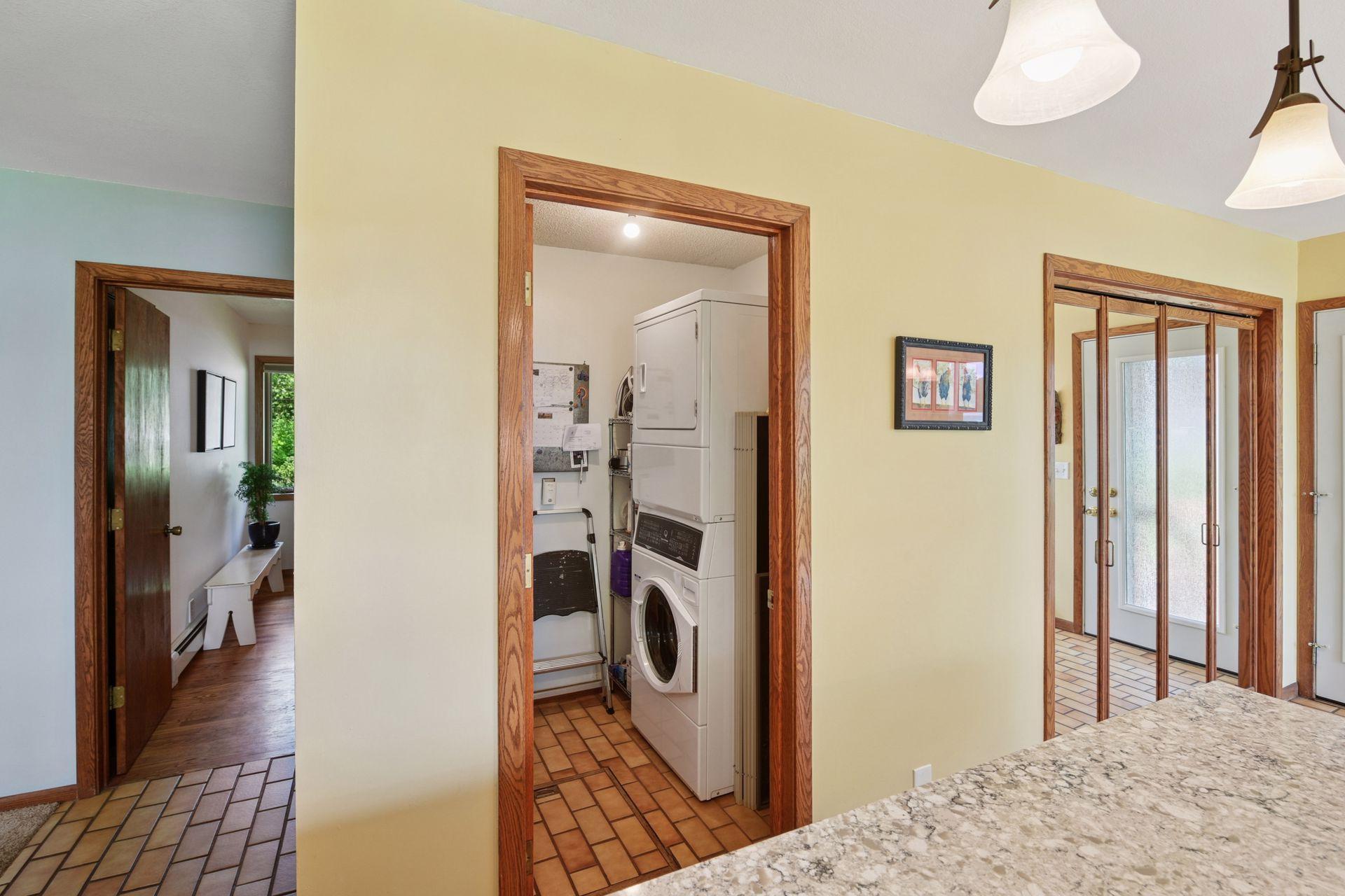 Main level laundry is located just off the kitchen.